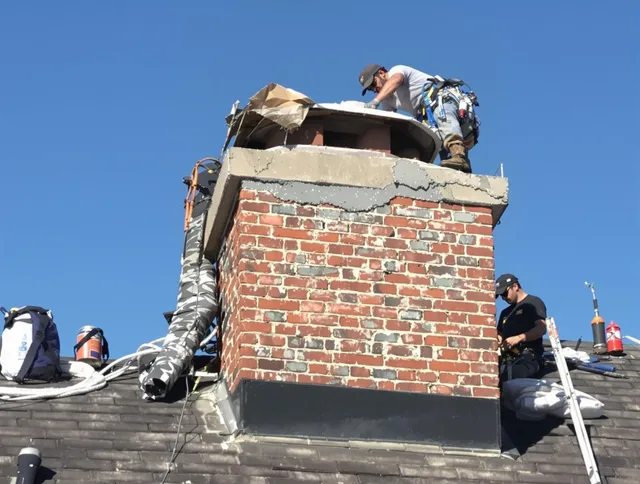 Cornelius Chimney Sweep installing a custom chimney crown in Cornelius, NC