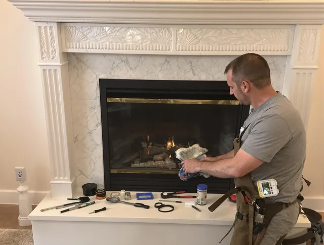 Cornelius Chimney Sweep performing fireplace maintenance in Cornelius, NC