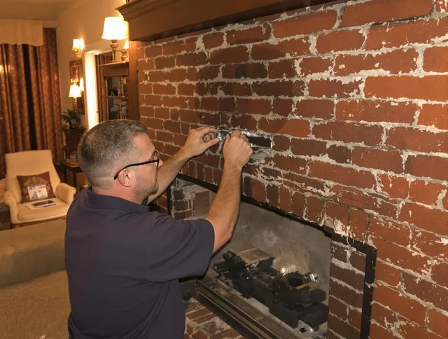 Cornelius Chimney Sweep expert fixing a fireplace in Cornelius, NC